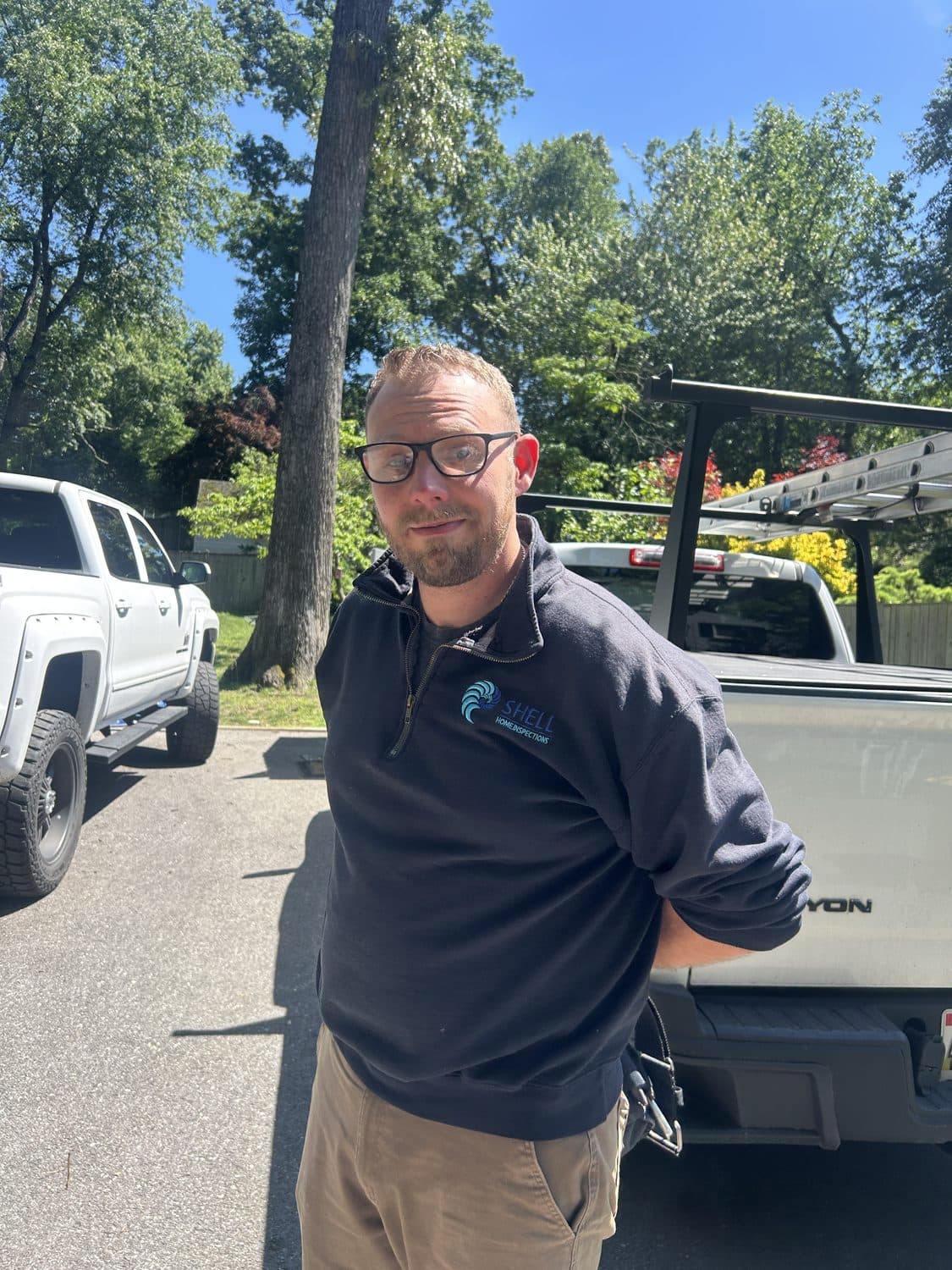 Matt on site with his inspection truck and ladder